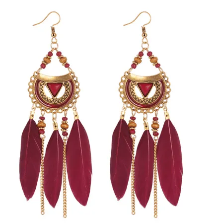 Chesevere - Long Boho Feather Earrings by The Nevermore