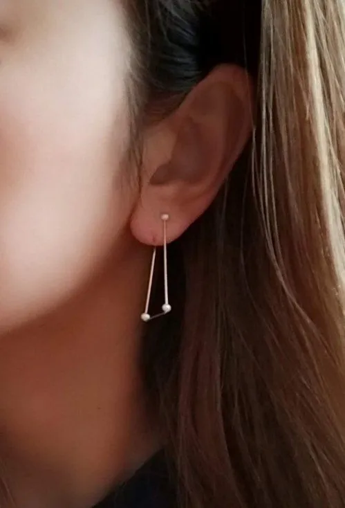 Reversible ear clip Rhythm